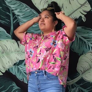 Loose floral Hawaiian shirt.